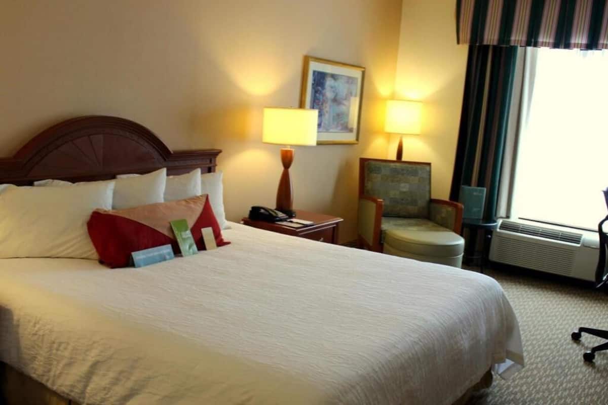 Premium bedding, desk, laptop workspace, blackout curtains