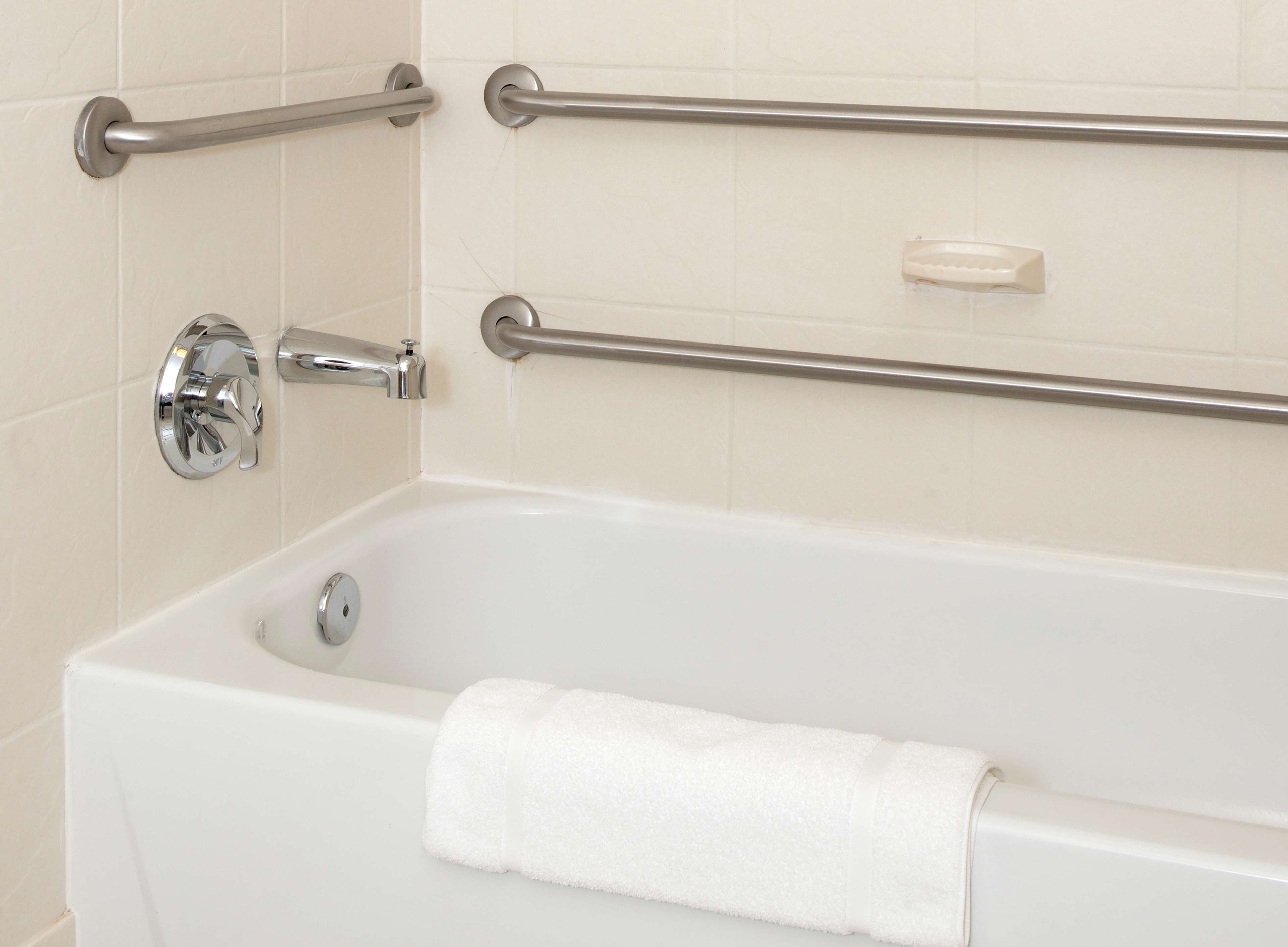 combined shower/bathtub, designer toiletries, hair dryer, towels