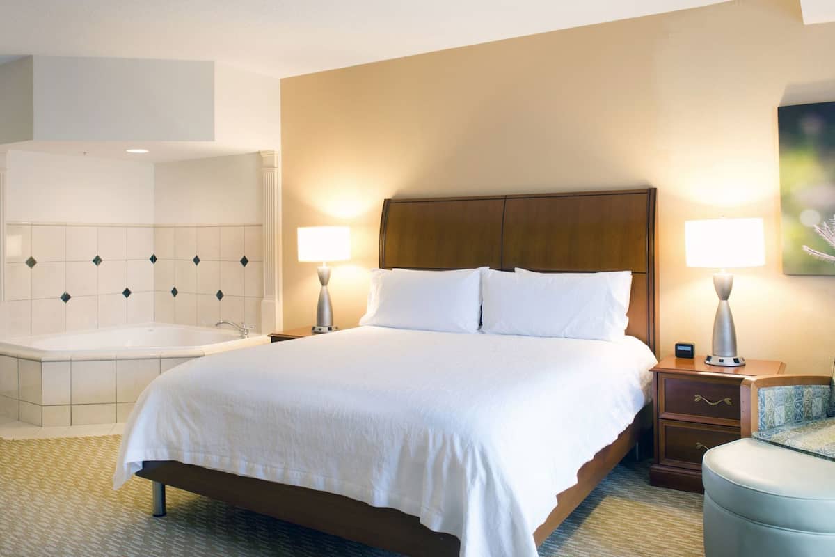 Premium bedding, desk, laptop workspace, blackout curtains