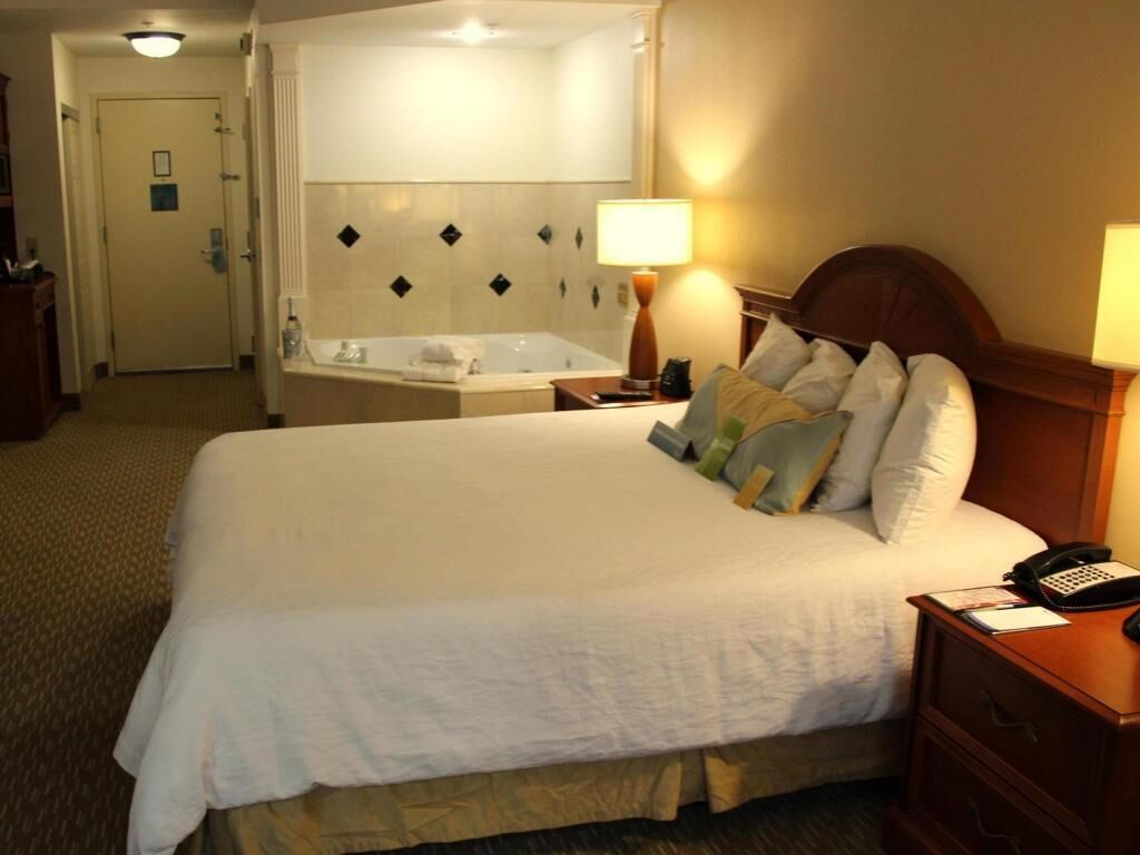 Premium bedding, desk, laptop workspace, blackout curtains