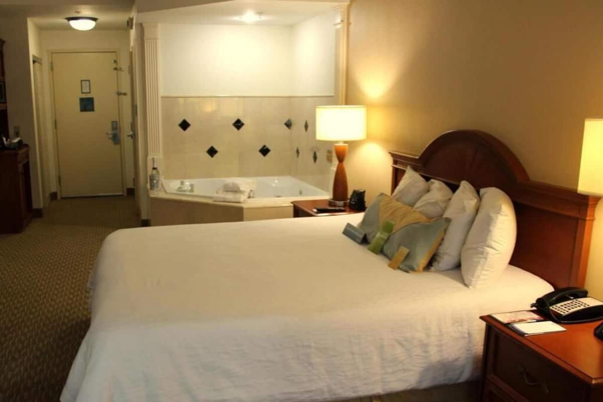 Premium bedding, desk, laptop workspace, blackout curtains