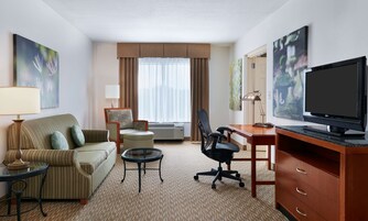 Premium bedding, desk, laptop workspace, blackout curtains
