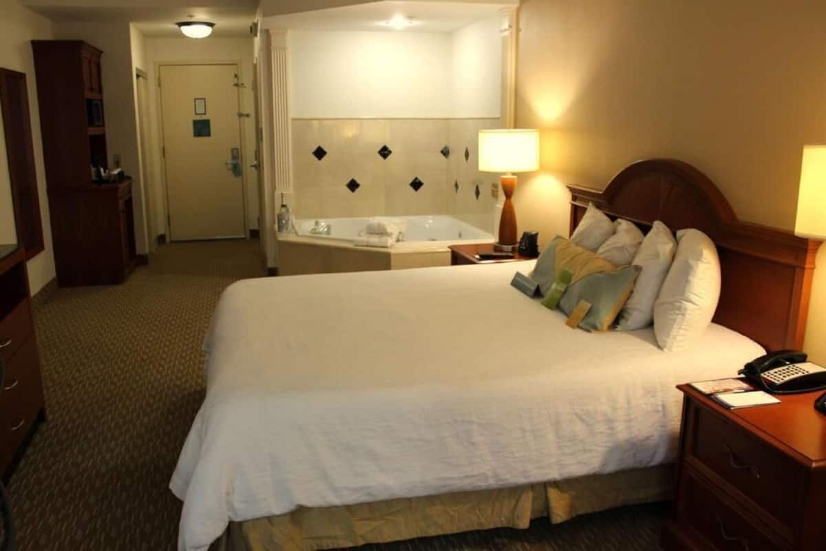 Premium bedding, desk, laptop workspace, blackout curtains