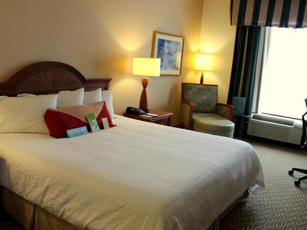 Premium bedding, desk, laptop workspace, blackout curtains