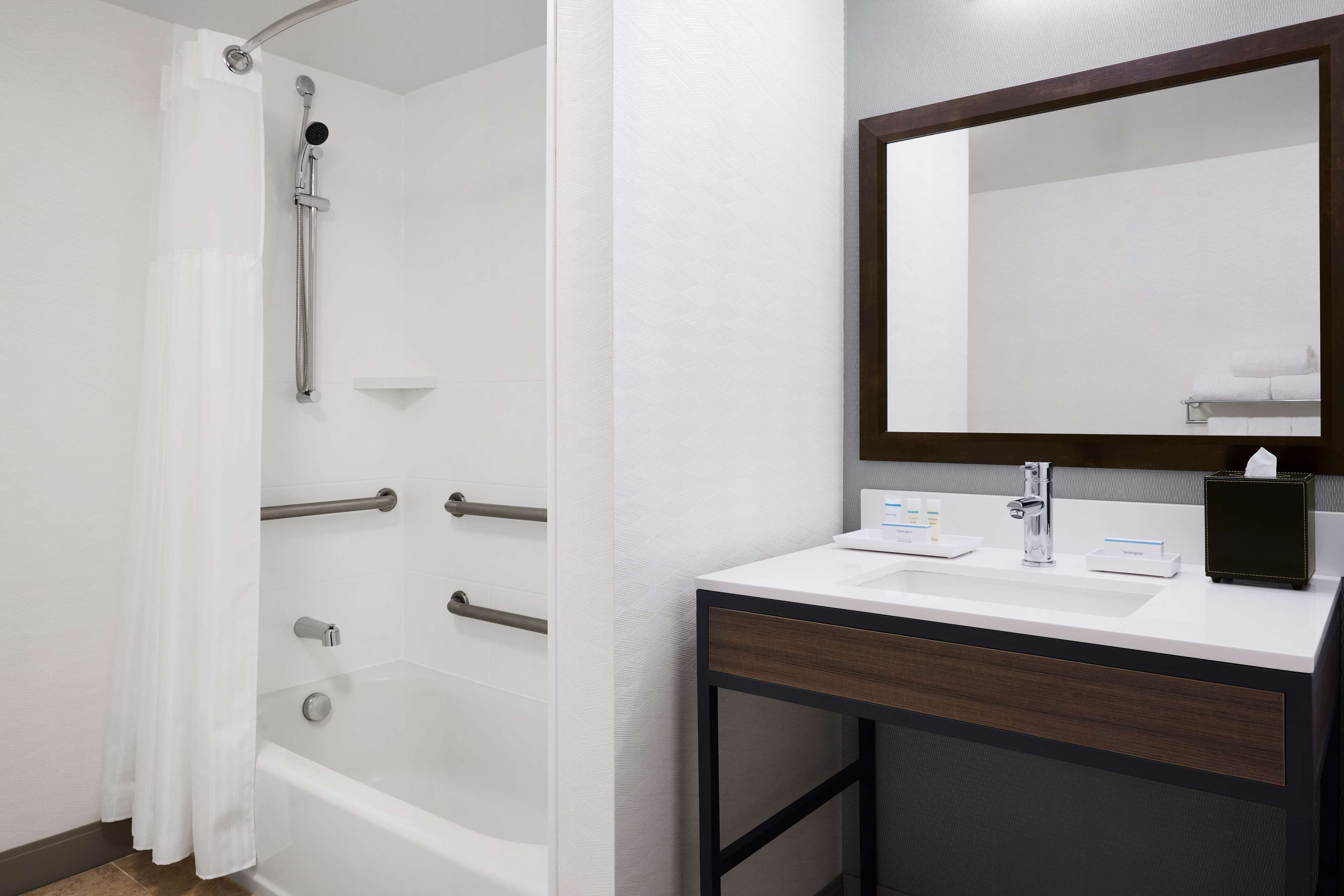 bathtub, hair dryer, towels