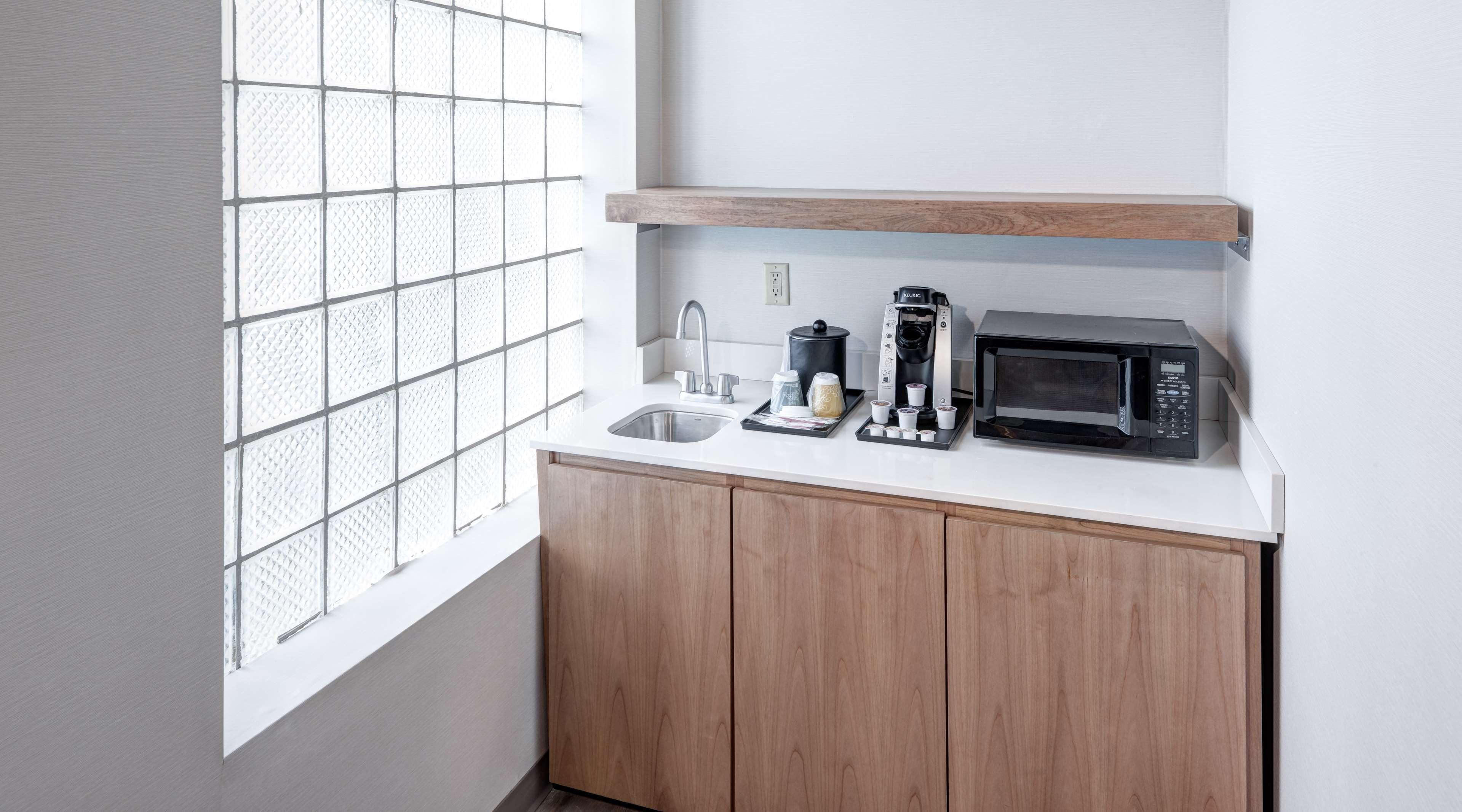 room, 1 king bed with sofa bed (wet bar) | desk, laptop workspace, iron/ironing board, free cots/infant beds