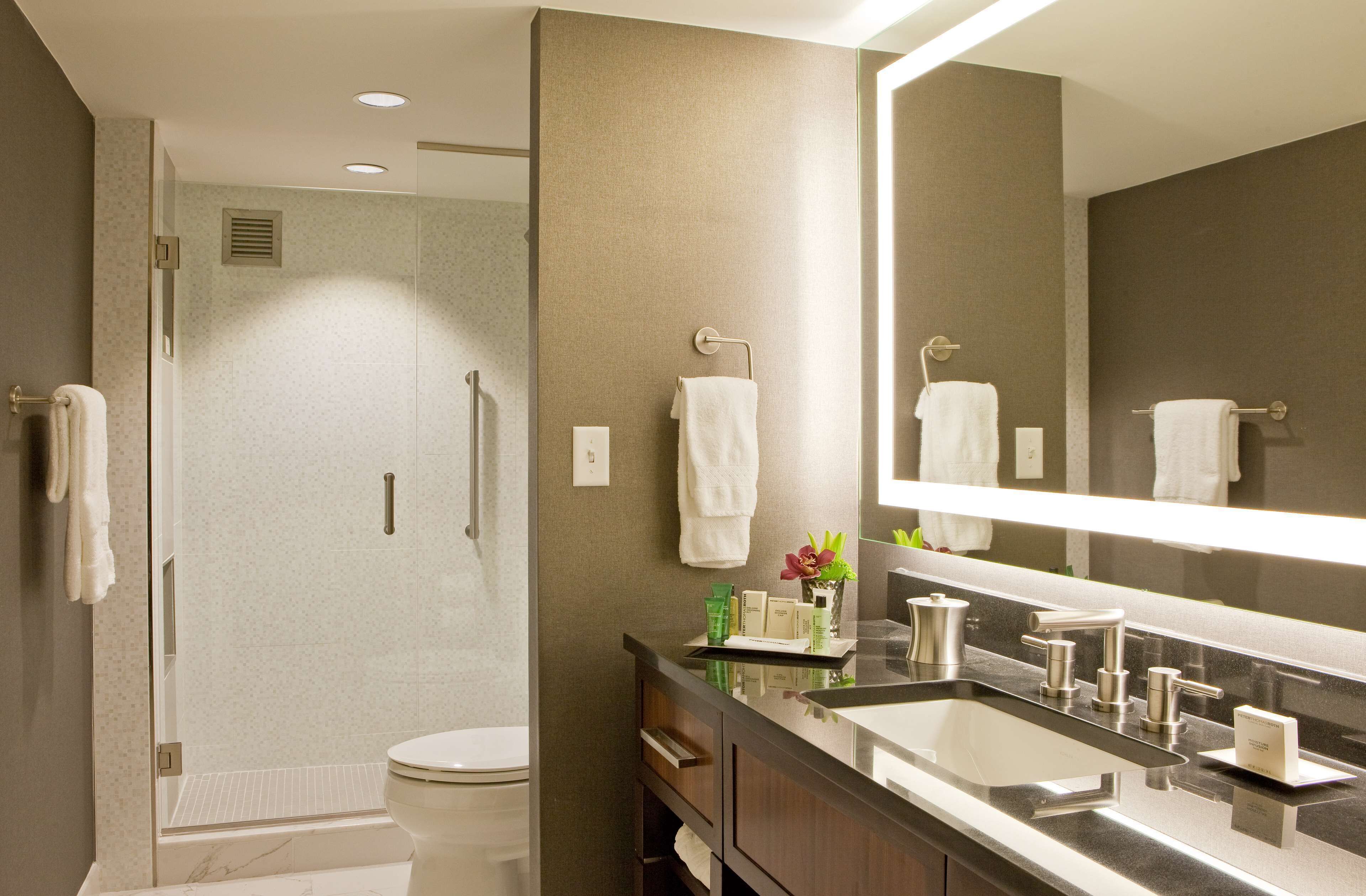 designer toiletries, hair dryer, bathrobes, towels