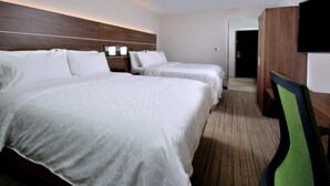 A hotel room with two beds, a flat-screen TV, a wooden headboard, and a carpeted floor. - Holiday Inn Express Durham by IHG (Durham)