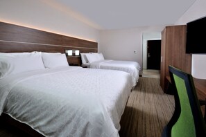 A hotel room with two beds, a flat-screen TV, a wooden headboard, and a carpeted floor. - Holiday Inn Express Durham by IHG (Durham)