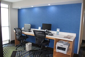 A hotel office with two desks, computers, chairs, and printers. - Holiday Inn Express & Suites Charlotte-Concord-I-85 by IHG (Concord)