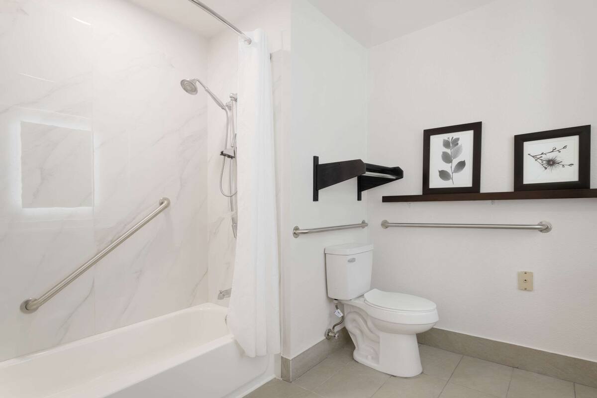 suite, 1 king bed, non smoking | in-room safe, desk, iron/ironing board, free cots/infant beds