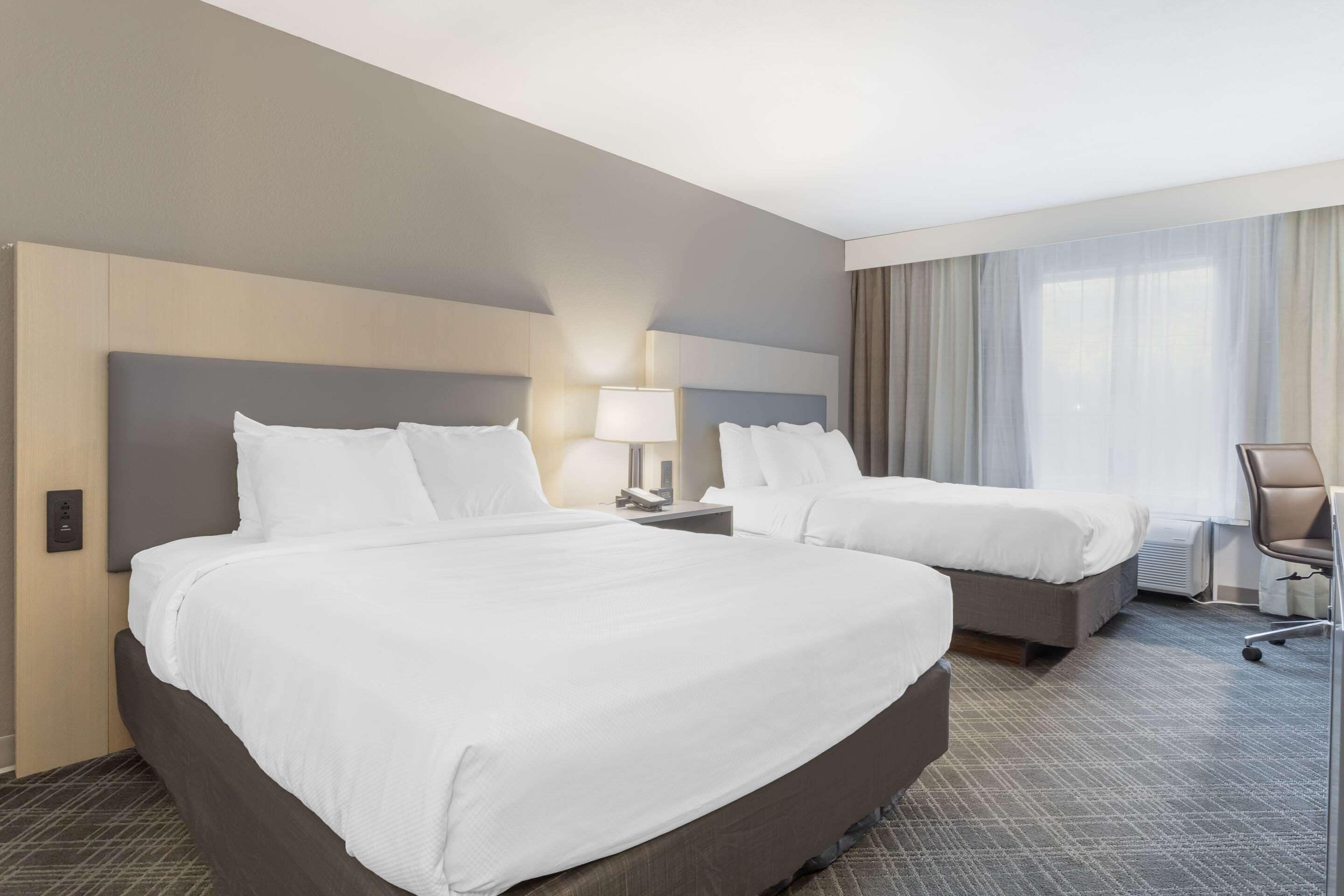 standard room, 2 queen beds, non smoking | in-room safe, desk, iron/ironing board, free cots/infant beds