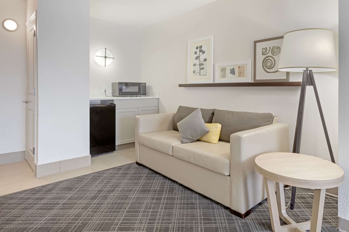 suite, 1 king bed, non smoking | in-room safe, desk, iron/ironing board, free cots/infant beds