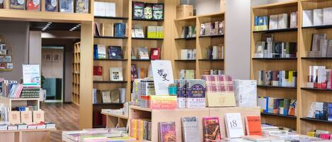 A bookstore with wooden shelves filled with books.