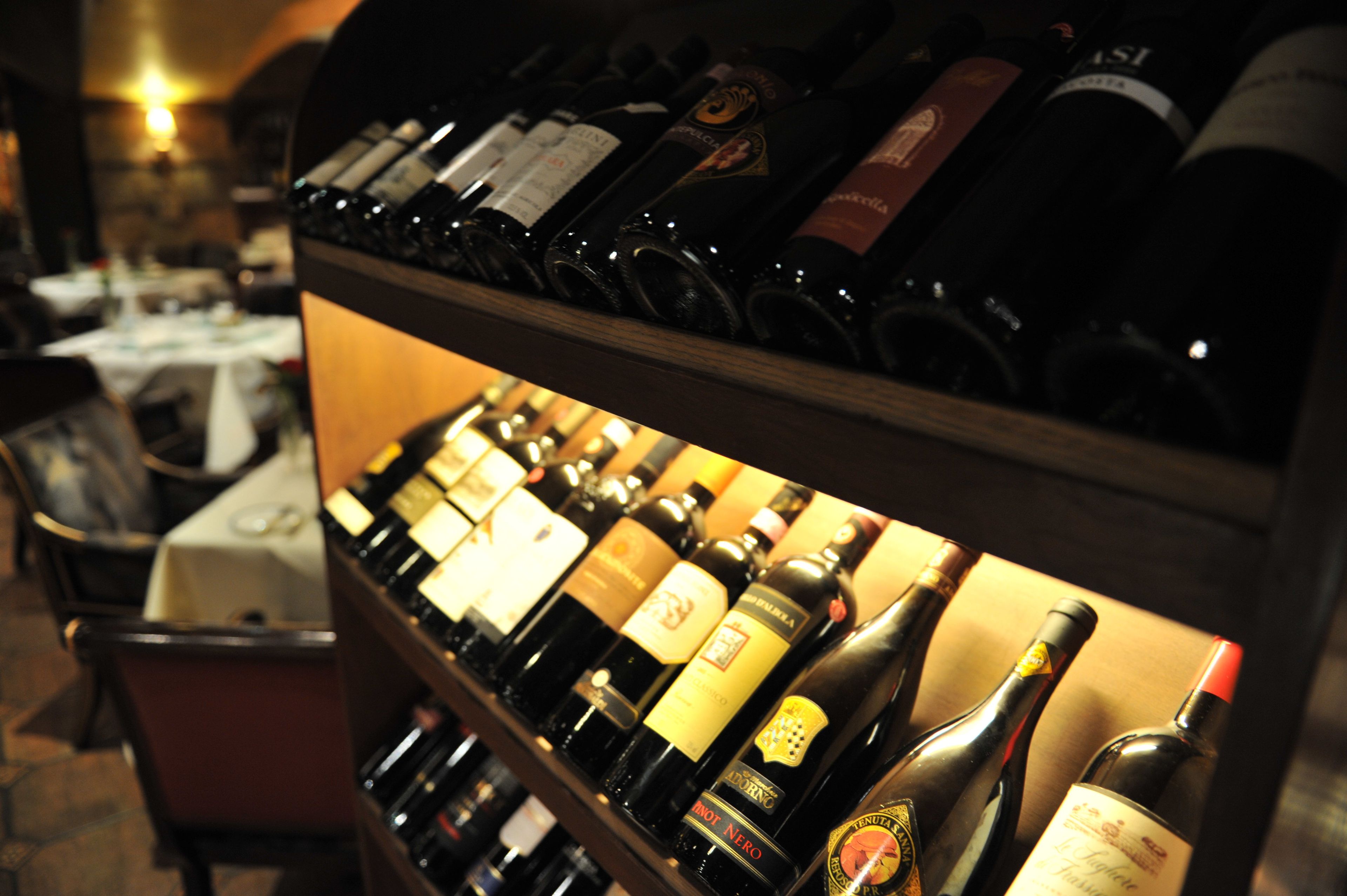 A wine rack with various bottles of wine.