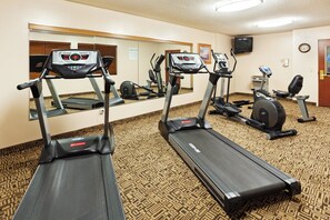 A hotel fitness center with treadmills, a stationary bike, and a mirrored wall. - HOLIDAY INN EXPRESS & SUITES REIDSVILLE by IHG (Reidsville)