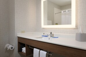 A modern bathroom with a white sink, mirror, and towel rack. - Holiday Inn Express Hotel & Suites Camden by IHG (Camden)