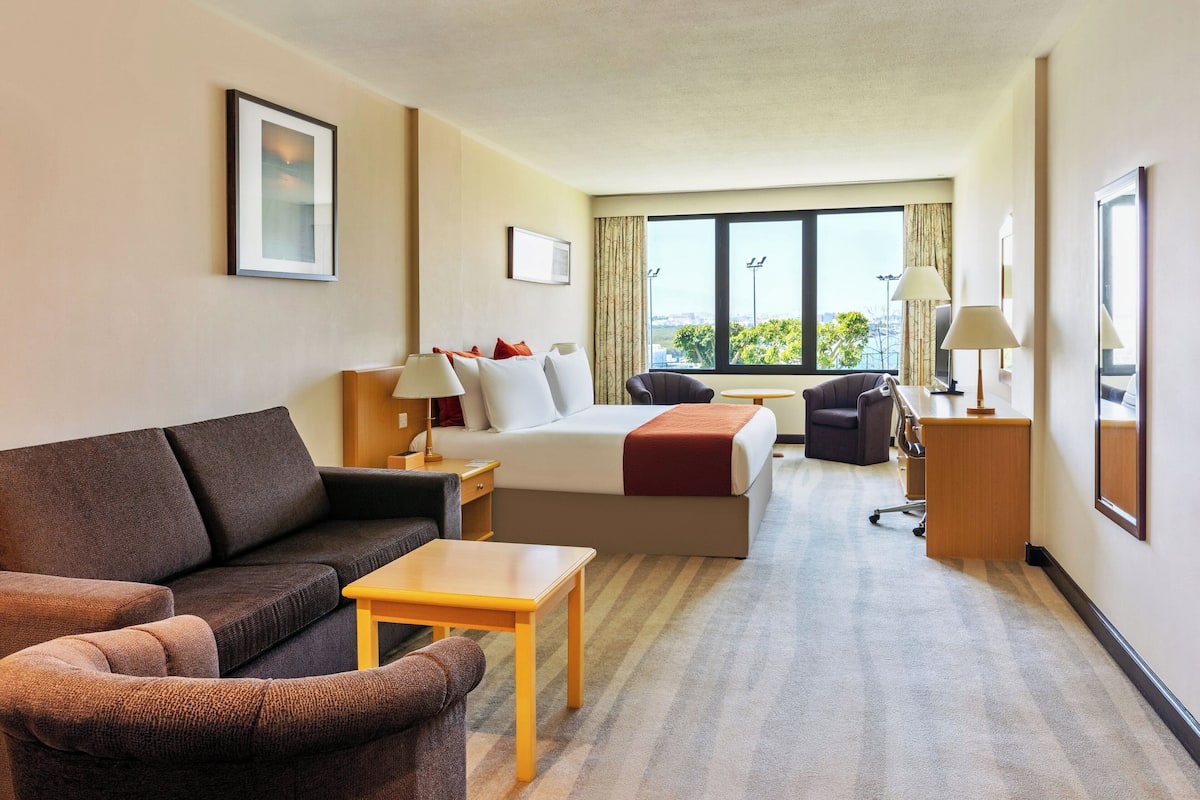 Family Room, 1 King Bed | 1 bedroom, down comforters, minibar, in-room safe