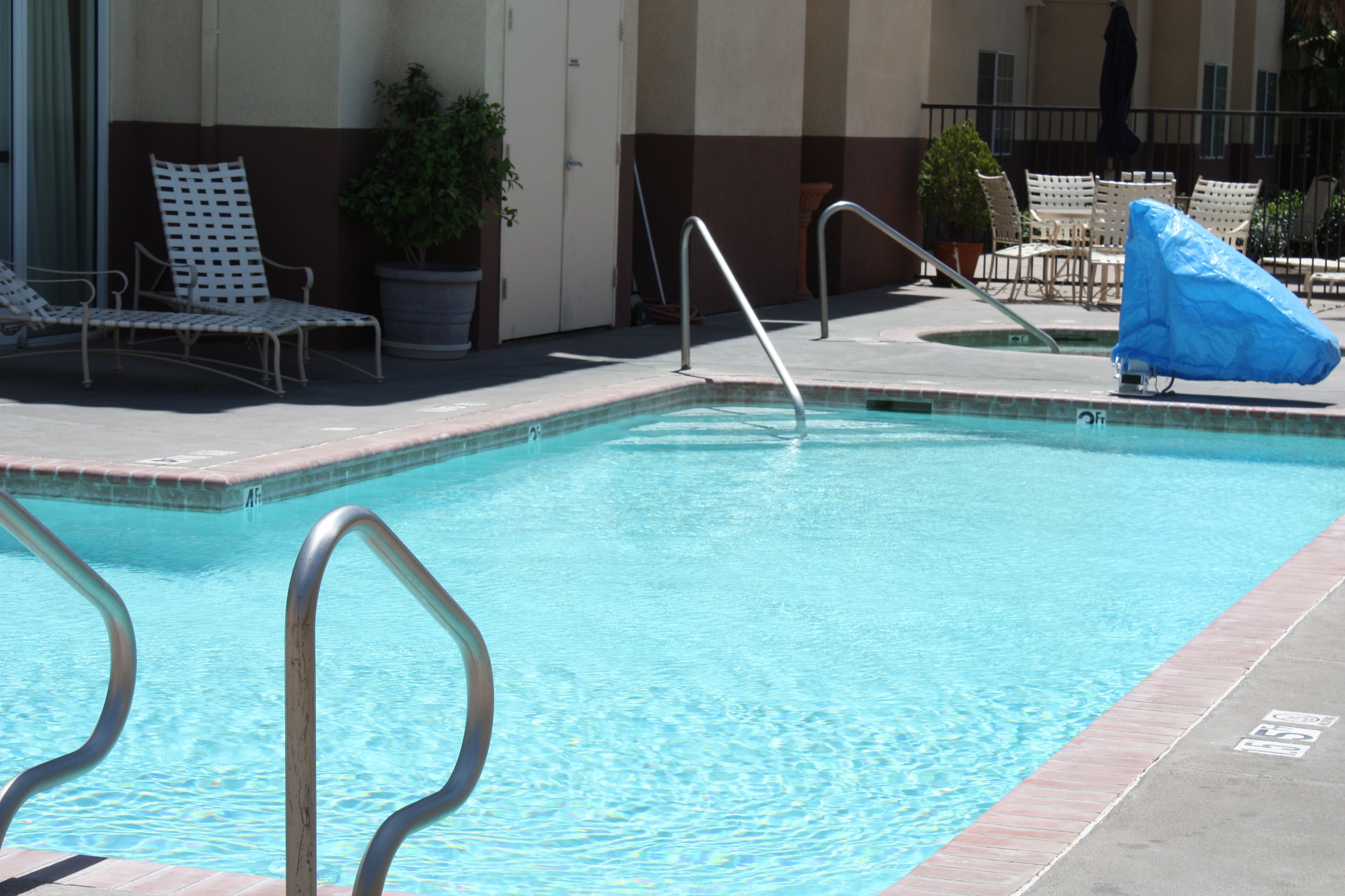 outdoor pool, pool umbrellas, pool loungers