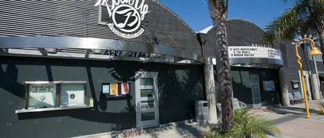 A building with a curved roof and a sign indicating it was established in 1974.