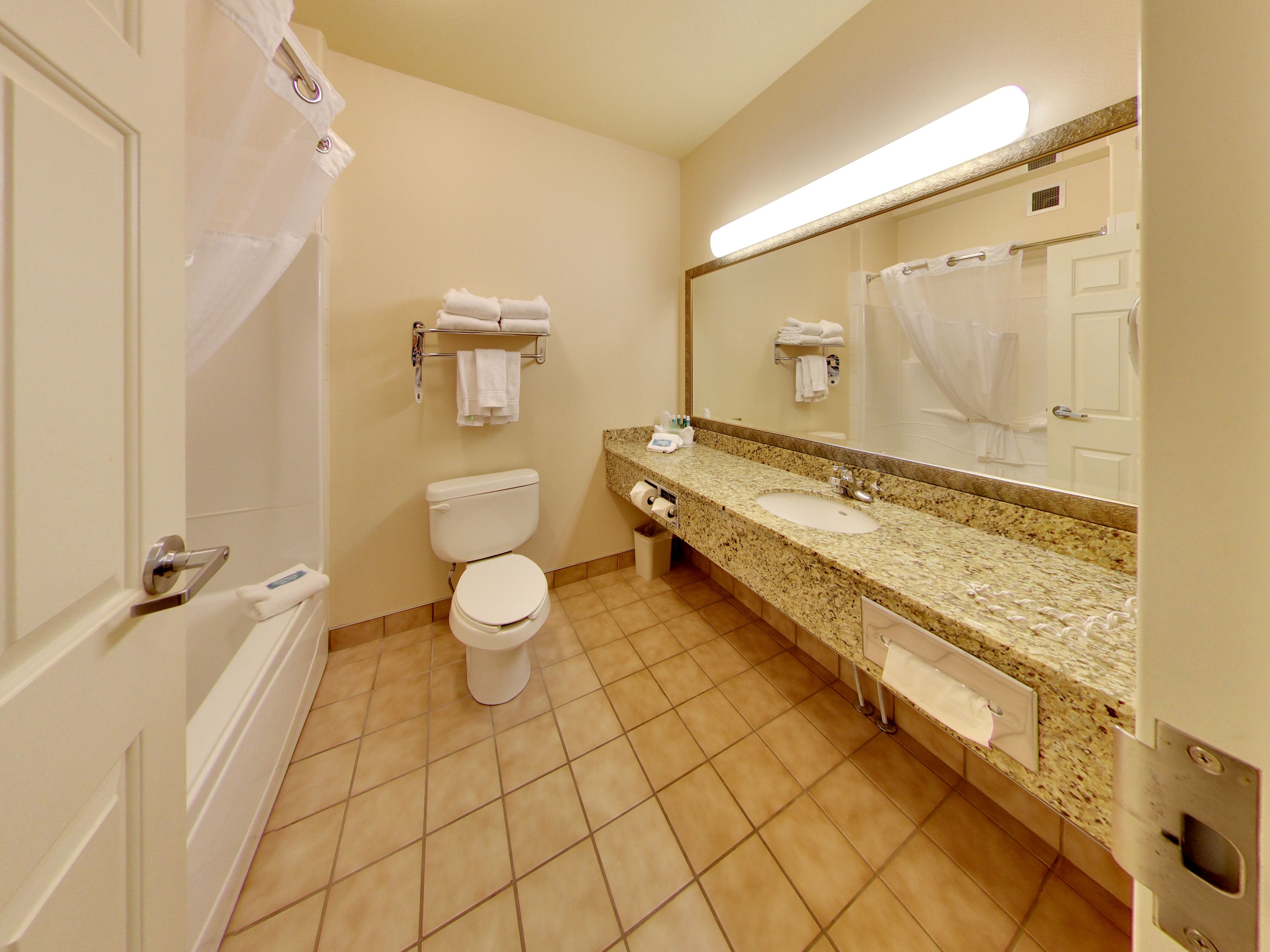 suite, 2 queen beds | bathroom | combined shower/bathtub, hair dryer, towels, soap