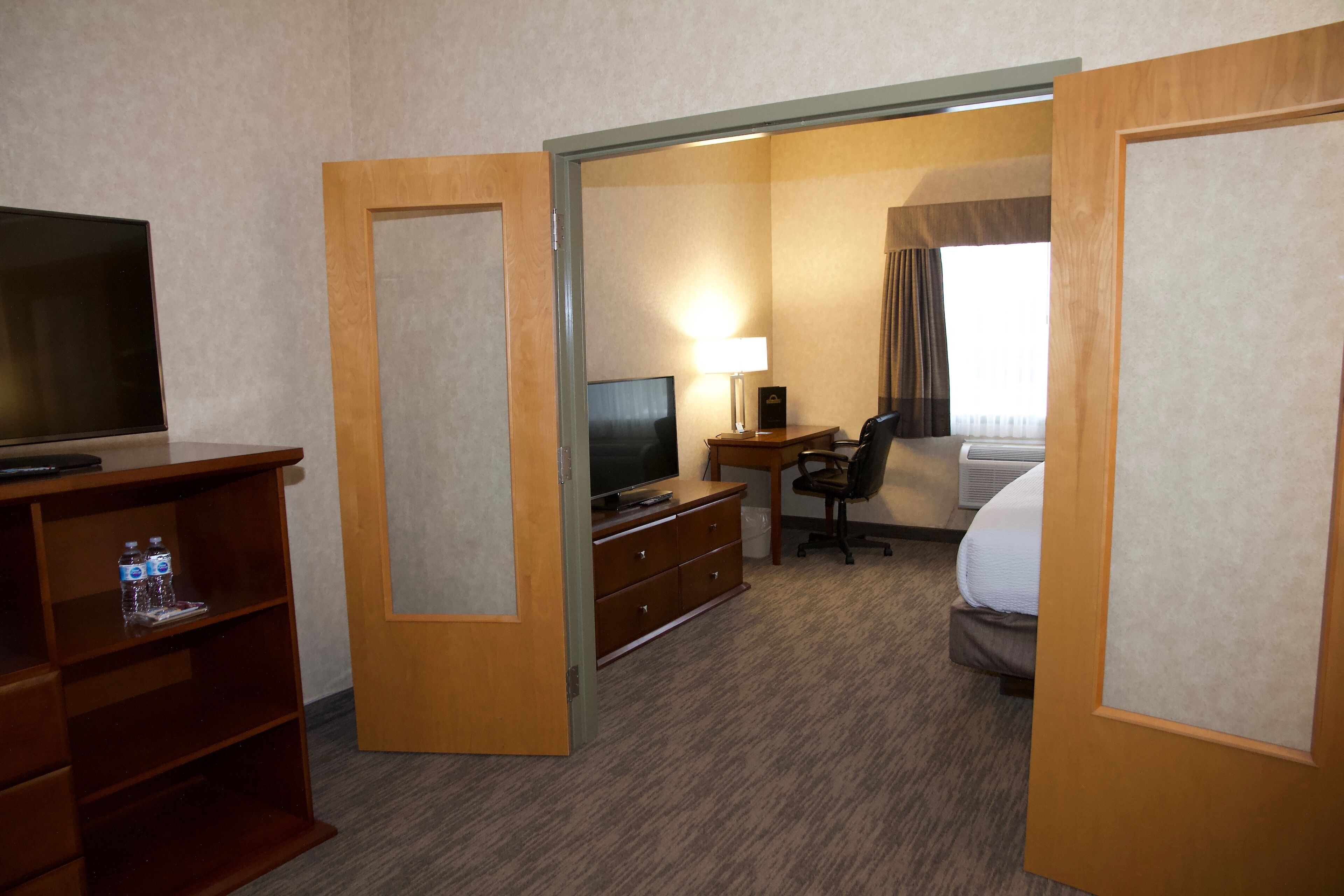 suite, 1 king bed with sofa bed, non smoking (two bedroom suite) | hypo-allergenic bedding, pillow-top beds, desk, laptop workspace