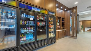 Refrigerated beverage and frozen food vending machines in a commercial setting. - Holiday Inn Express Breezewood by IHG (Breezewood)