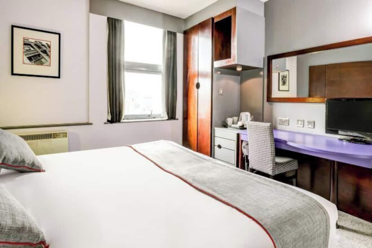 Premium bedding, pillow-top beds, desk, laptop workspace