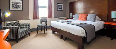 Premium bedding, pillow-top beds, desk, laptop workspace