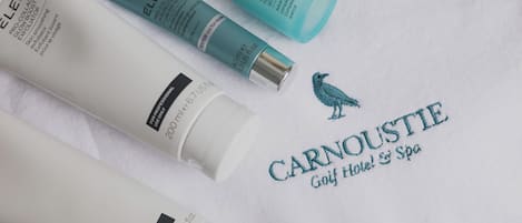 A collection of skincare products from ELEMIS and a Carnoustie Golf Hotel & Spa towel.