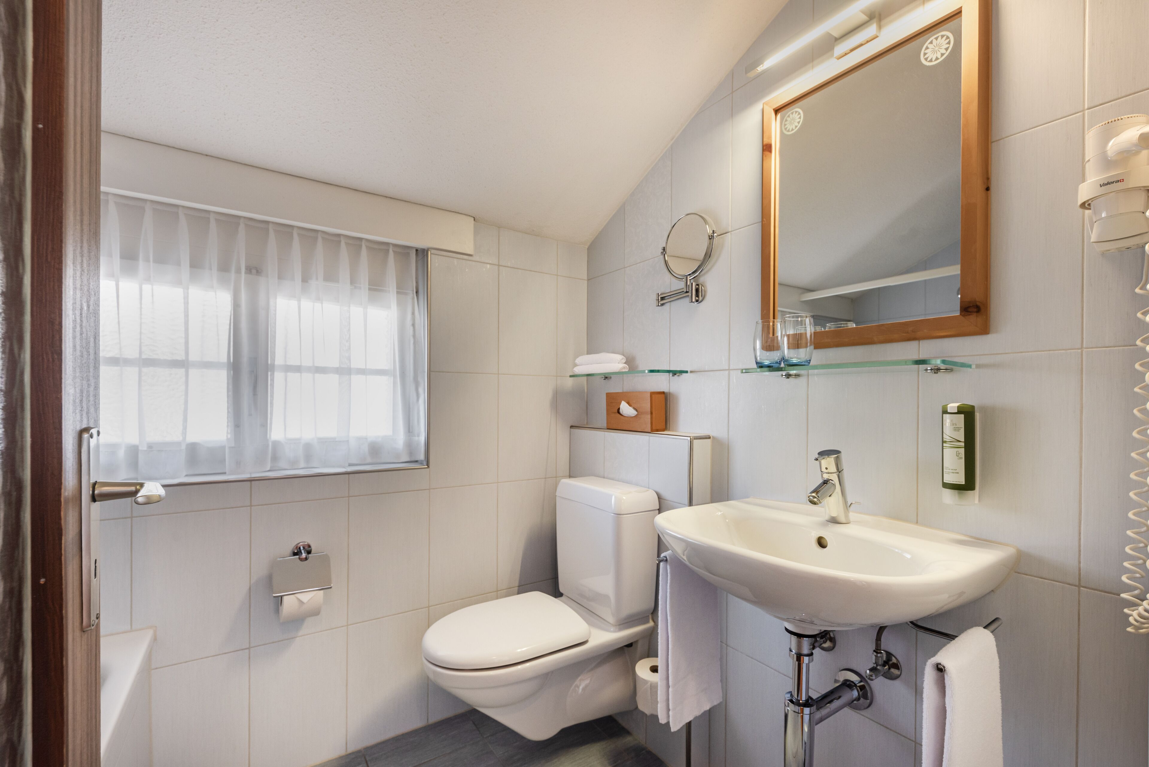 family apartment | bathroom | hair dryer, towels