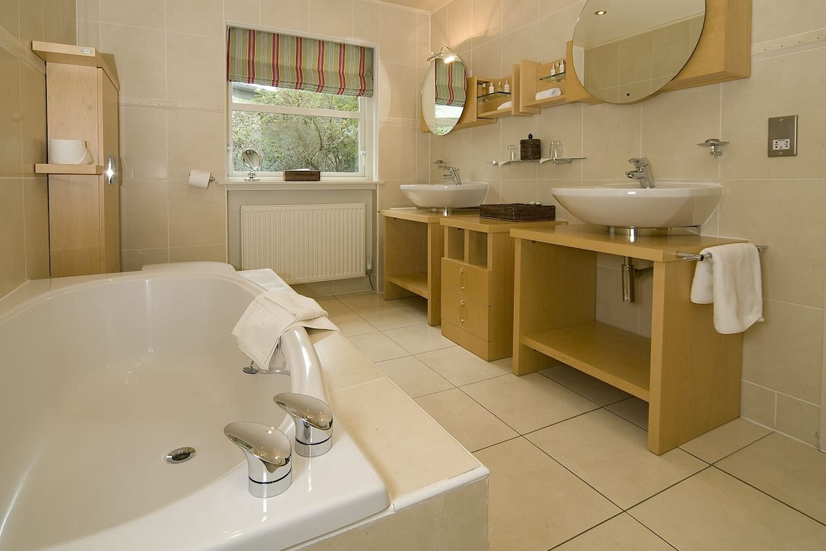 spa suite | bathroom | separate bathtub and shower, free toiletries, hair dryer, bathrobes