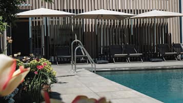 Indoor pool, outdoor pool, open 11:00 AM to 8:00 PM, pool umbrellas