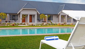 2 outdoor pools, open 7:00 AM to 7:00 PM, pool umbrellas, pool loungers