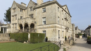 A large, historic stone building with multiple windows and a prominent entrance. - The Painswick (Stroud)