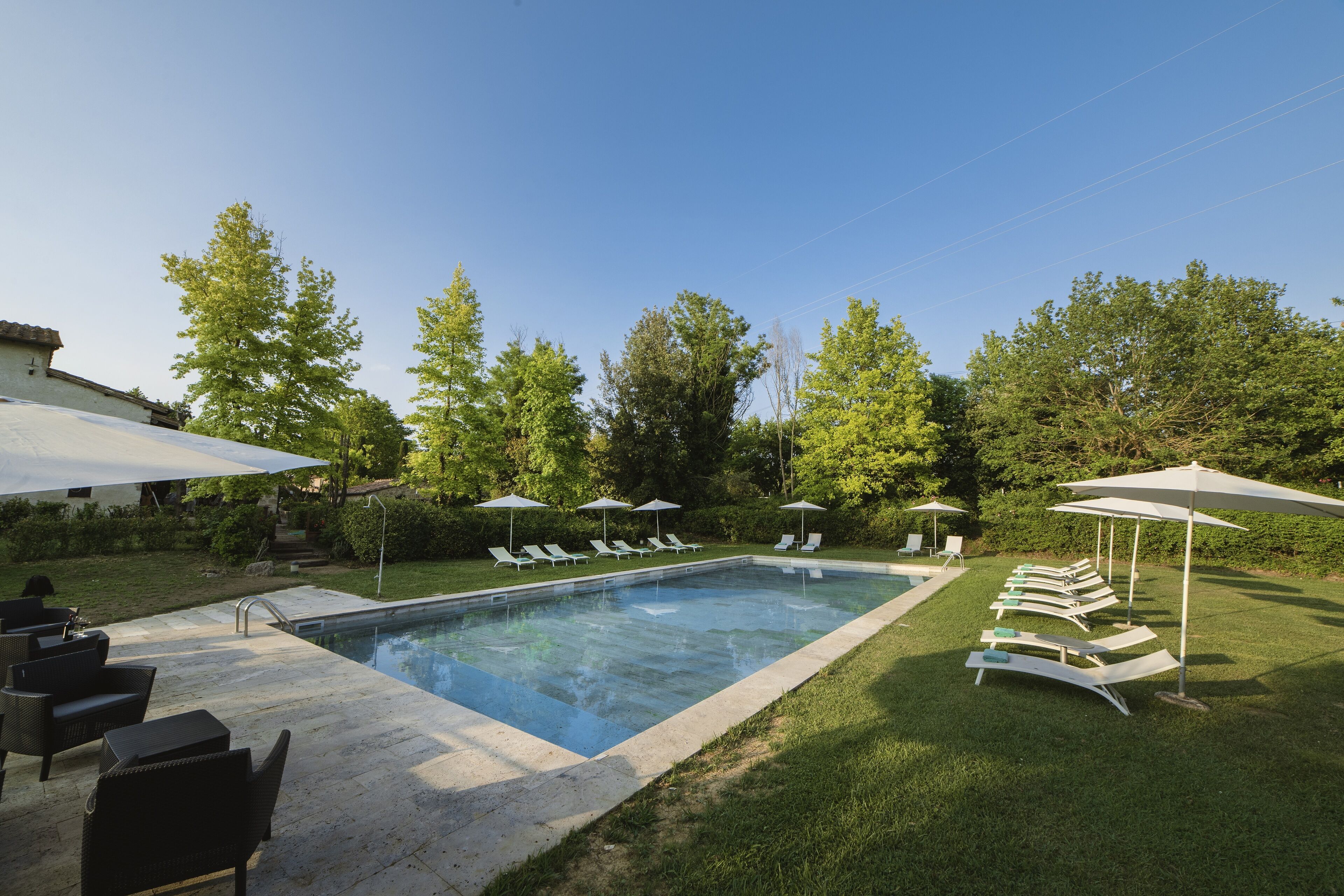 outdoor pool, open 9:00 am to 8:00 pm, pool umbrellas, pool loungers