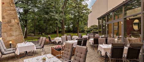 Dinner served, Regional cuisine, garden views