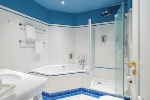 Shower, designer toiletries, hair dryer, towels