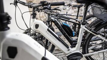 A bicycle with a white frame and the brand name 'KALKHOFF' visible.