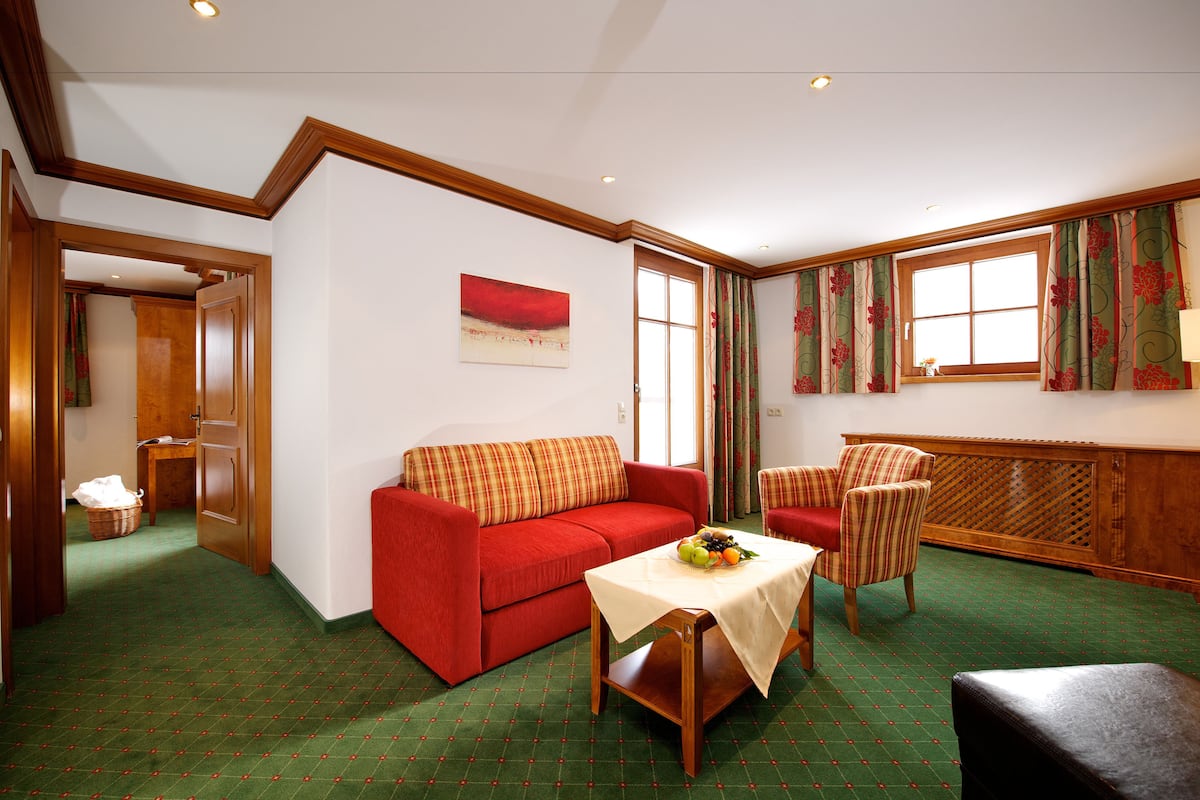 Superior Suite, Balcony | Living room | TV