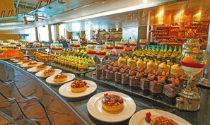 A buffet with various desserts and pastries. - Safir Sharm Waterfalls Resort (Sharm El Sheikh)