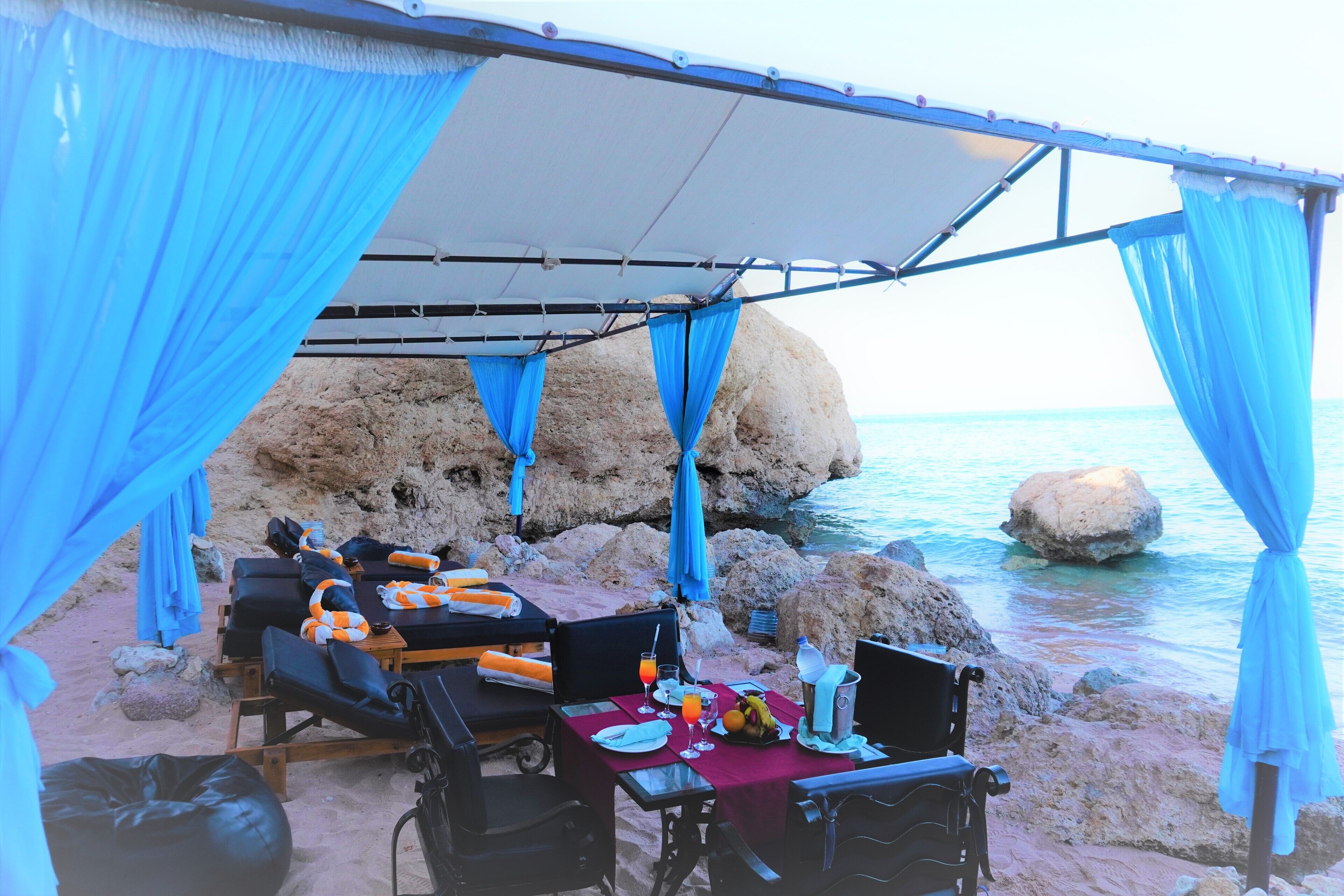 private beach, beach umbrellas, beach towels, beach massages