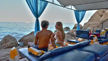 Private beach, beach umbrellas, beach towels, beach massages