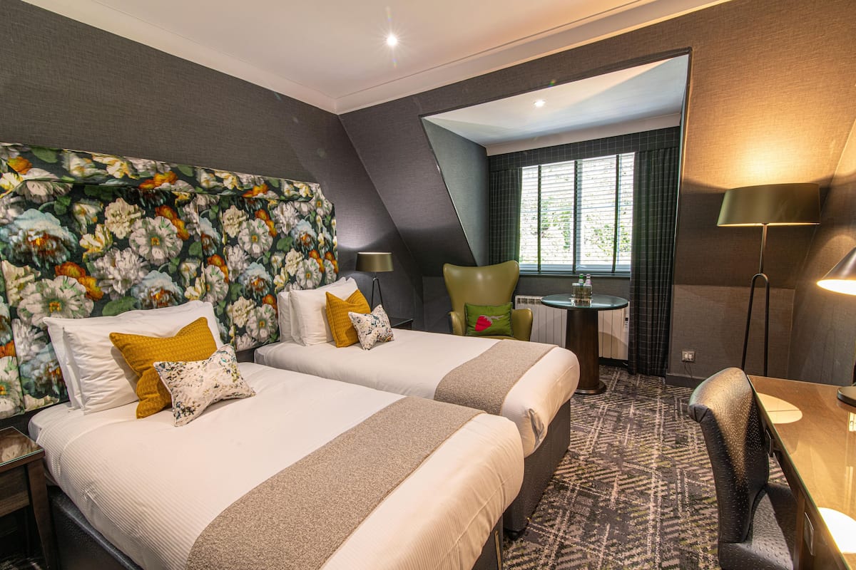 Twin Room | Individually decorated, desk, laptop workspace, iron/ironing board