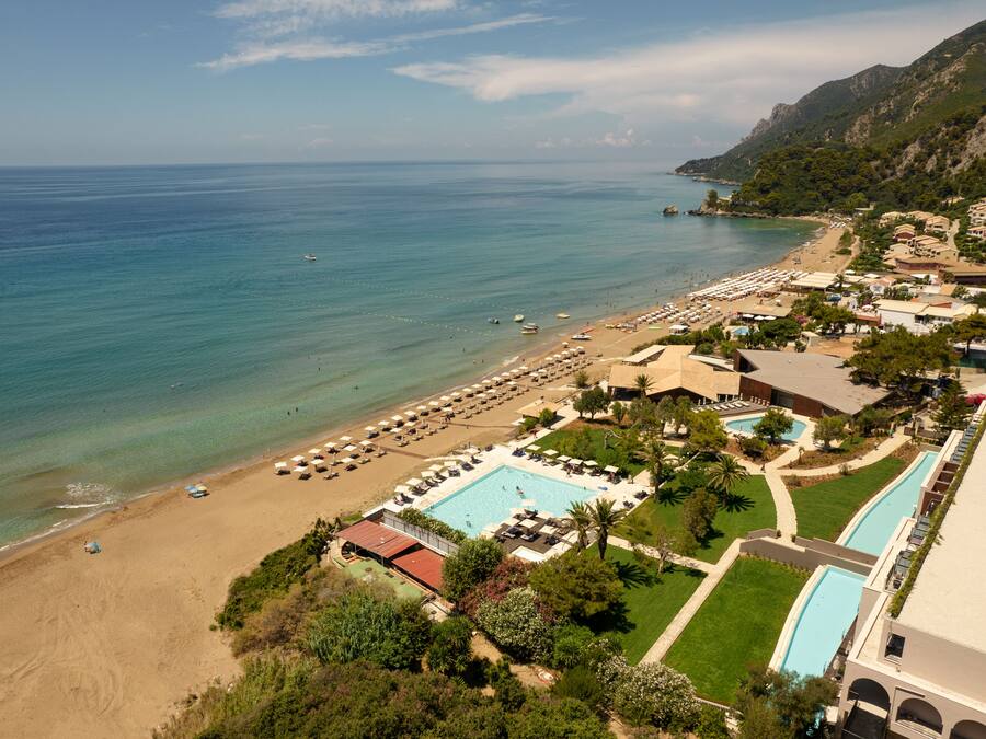 On the beach, white sand, sun loungers, beach umbrellas