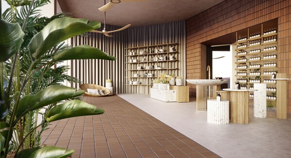 A modern interior with a brick floor, a large bookshelf, a wicker chair, and a variety of plants. - Domes of Corfu Autograph Collection (Corfu)