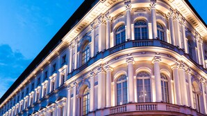 A classical building with arched windows and columns, featuring a balcony with balustrades. - Raffles Europejski Warsaw (Warsaw)