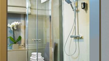 Suite, 1 King Bed | Bathroom | Shower, hair dryer, towels
