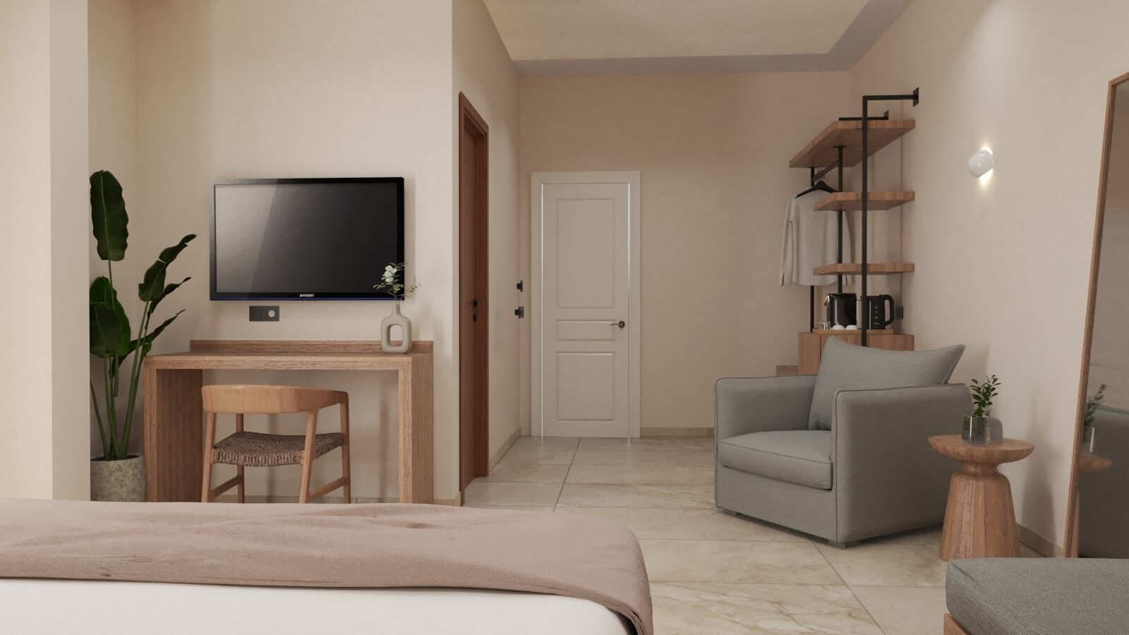 A modern hotel room with a bed, a desk with a chair, a grey armchair, a television, and a wardrobe.