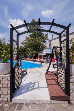 Outdoor pool, free pool cabanas, pool umbrellas